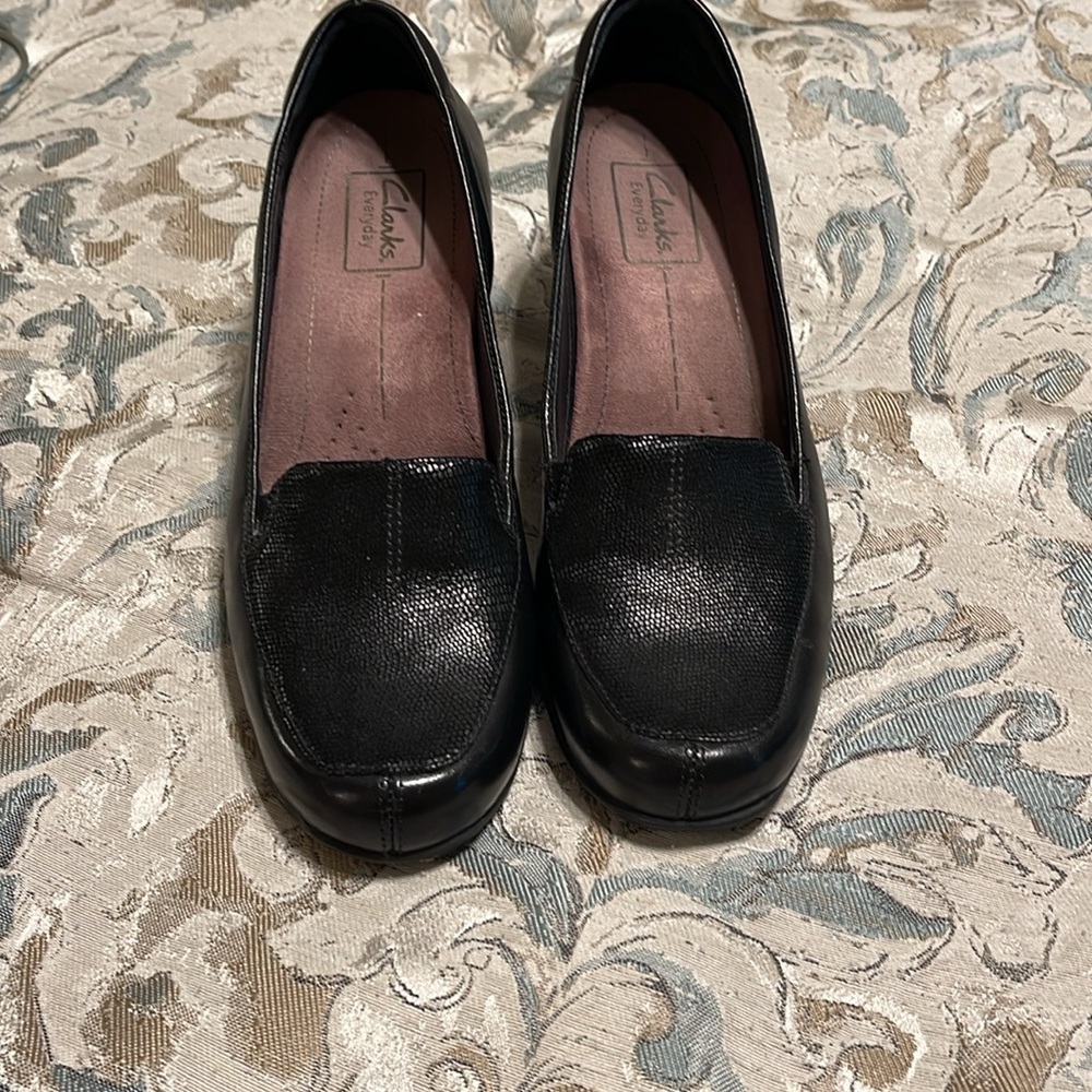 Clark’s black leather shoes